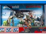 coffret de jeu « Dragons » dans une boîte bleue, contenant un dragon et d'autres jouets
