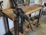 a workbench with tools on it in a garage