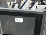 a tv that is sitting in the middle of a pile of junk