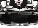 two seats in the back of a car that is open