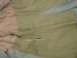 a pair of pants that are laying on a bed