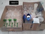 two boxes of empty wine glasses and a bottle in them