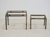 pair of brass side tables with glass tops and legs