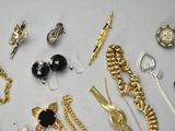many different types of jewelry on the table