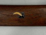 a close up of a wooden object with shells on it