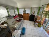 a living room with a couch and a television in it