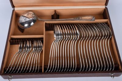 a wooden box with a set of silverware in it