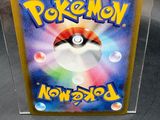a picture of a pokemon card in a clear box