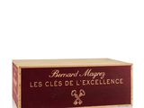 the wooden box is holding a bottle of wine and a bottle of wine