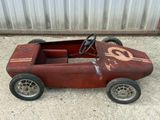 a small toy car with a number on the front