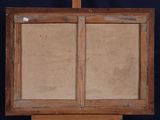 an old wooden easel with a piece of paper on top of it