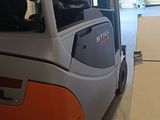 a fork lift truck parked in a warehouse