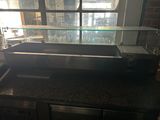 an image of a counter top with a glass display case