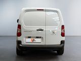 a white van that is parked in a room