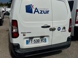 a white van that is parked in a parking lot