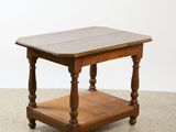 a small wooden table with a shelf underneath it