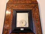 a picture of a mirror with a toilet in it
