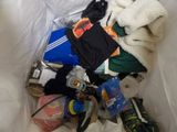 a pile of clothes and other items in a plastic bag