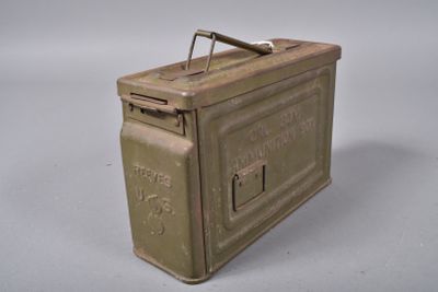 a small metal box that has a handle on it