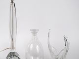 three glass vases sitting next to each other on a white surface