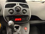 a dashboard of a small car with a red light on it