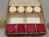 a box with wax stamps and a roll of twine of twine of twine of twine of twine of twine of twine