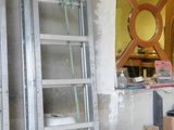 a man that is standing in a room with a ladder
