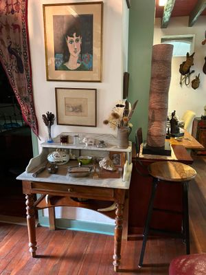 a picture of a room with a table and a chair