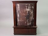 a small wooden clock with a wooden case on it