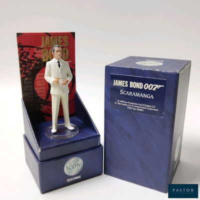 a figurine of a man in a white suit in a blue box