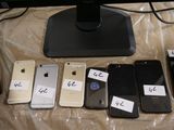many cell phones that are sitting on a table
