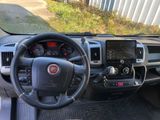 the interior of a truck with a steering wheel and dashboard controls