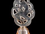 an image of a glass sculpture of a cat on a pedestal