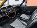 a dashboard and steering wheel of a classic car