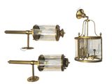 trois appliques murales en laiton et en verre sur fond blanc