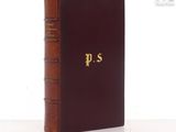 a close up of a book on a table with a white background