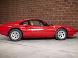 a red sports car parked in front of a brick wall