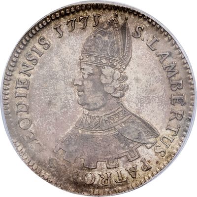 a close up of a coin with a crown on top of it
