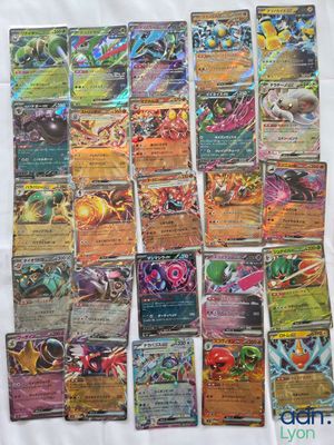 a bunch of pokemon cards sitting on top of a table
