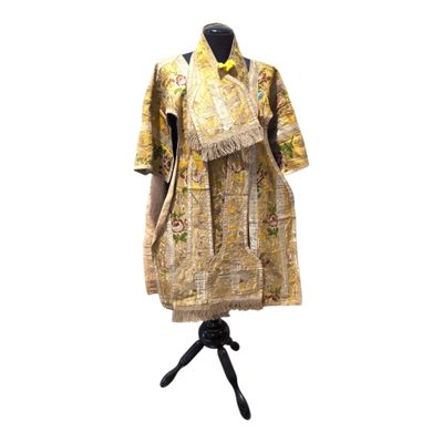 an image of a dress on a mannequin stand with a white background
