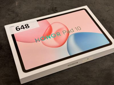 a box with a tablet on top of it sitting on a table