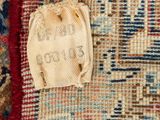 a close up of a rug with a piece of fabric on top of it