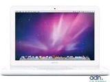 an image of a white apple macbook computer on a white surface