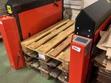 a machine that is sitting on a pallet in a warehouse