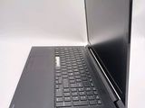 a laptop that is open on a white surface
