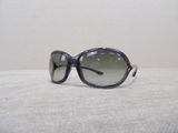 a pair of sunglasses sitting on a white surface