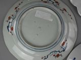 three plates with designs on them on a table