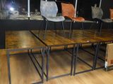 four chairs and a table in a room with a large window