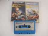 two cassettes sitting on a table next to each other
