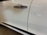 a close up of a car door handle with a sticker on it